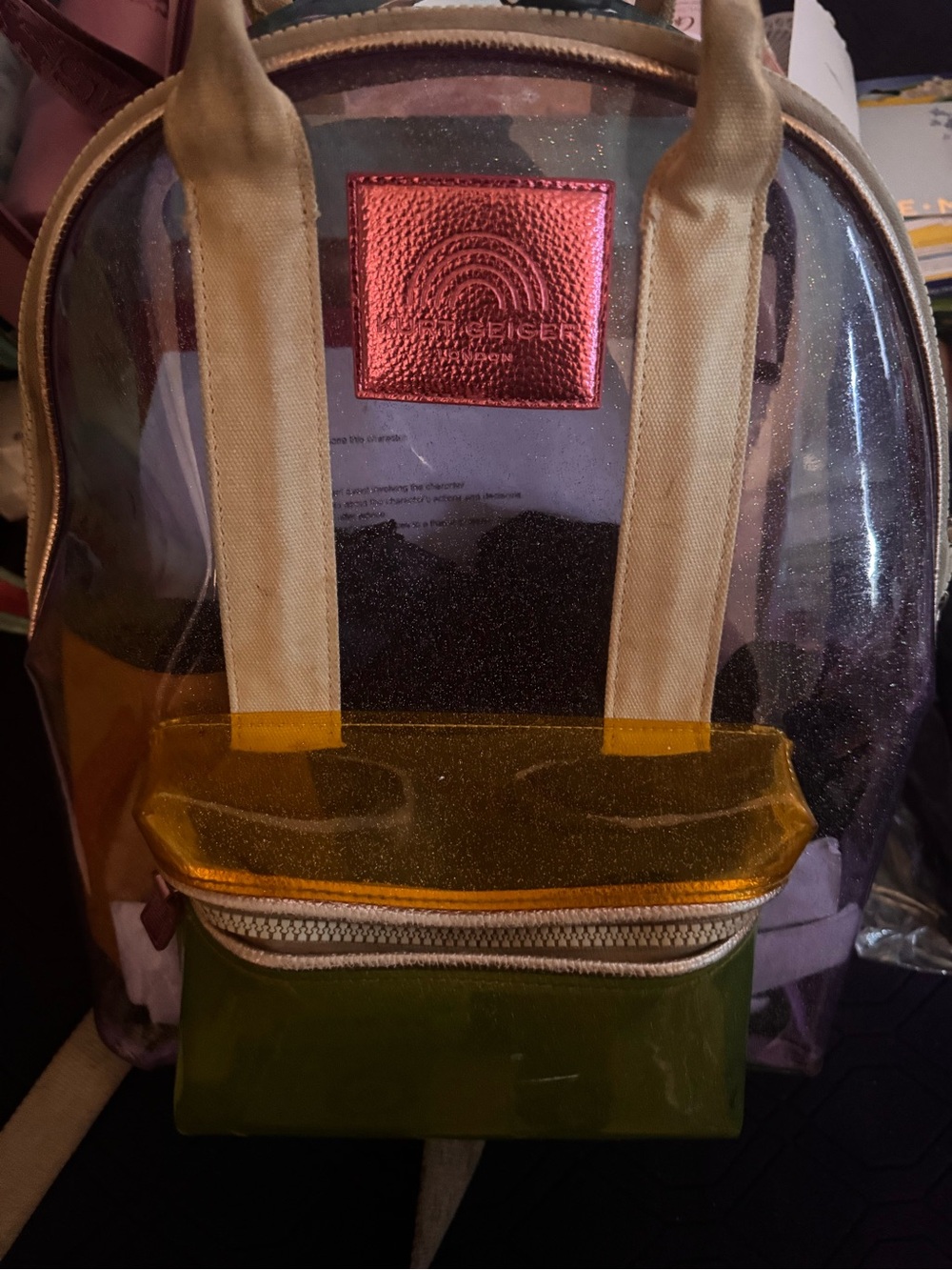 Kurt Geiger Clear Backpack with Pink Metallic Logo and Yellow, Green Accents